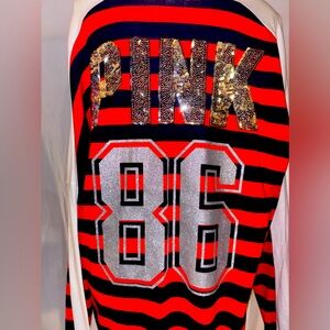 PINK Red, white, and blue striped shirt.